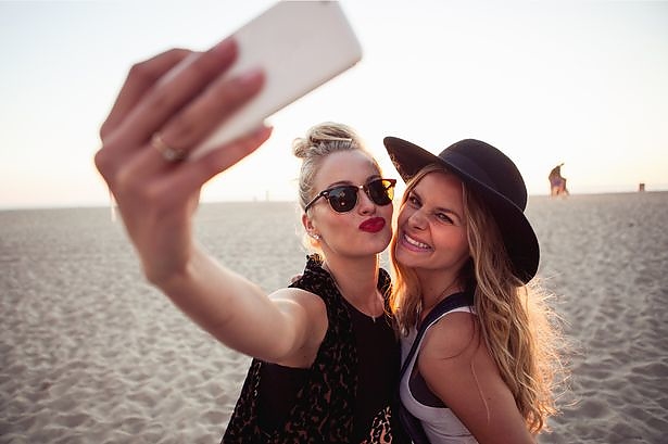 female-friends-photographing-themselves-on-smartphone.jpg female-friends-photographing-themselves-on-smartphone.jpg