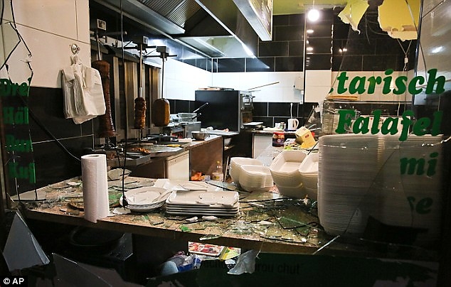 300e77da00000578-3395246-the_smashed_remains_of_the_front_window_of_a_turkish_snack_resta-a-27_1452588142023.jpg